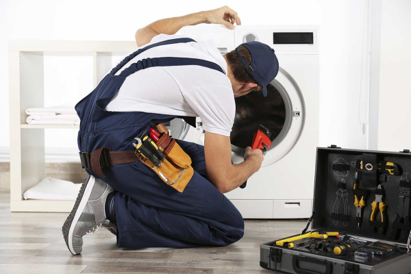 Technician performing dryer repair services in a Folsom, CA home.